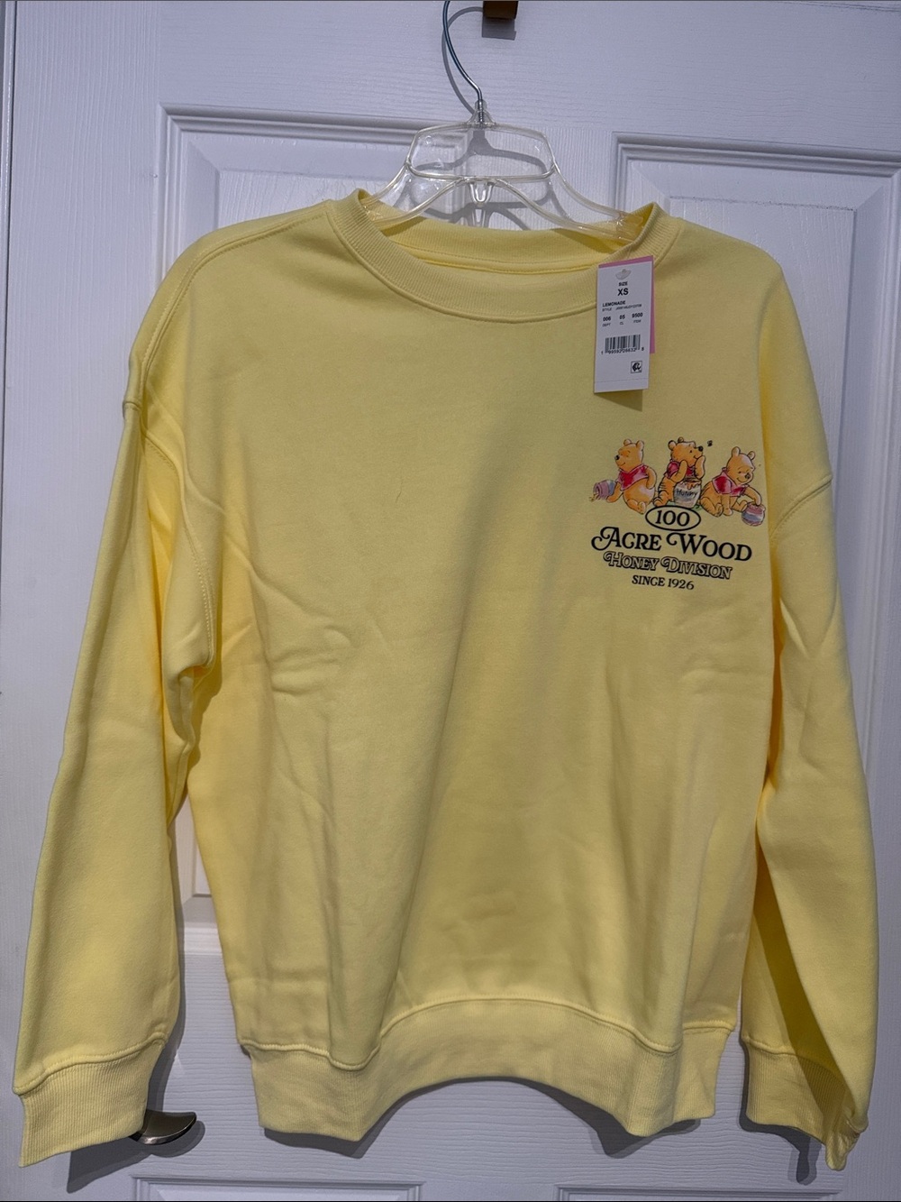 NWT Disney Yellow Winnie the Pooh 100 Acre Wood Sweatshirt. Size XS.